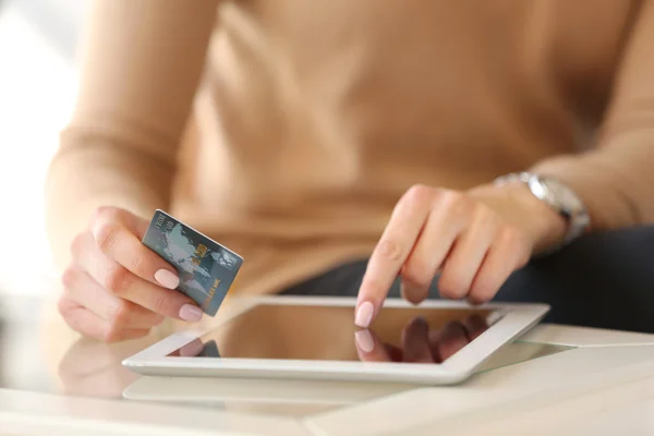 Girl with tablet and credit card