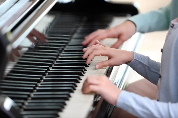 Girl learning play piano