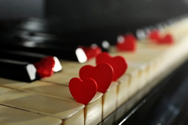 Red hearts on piano keys