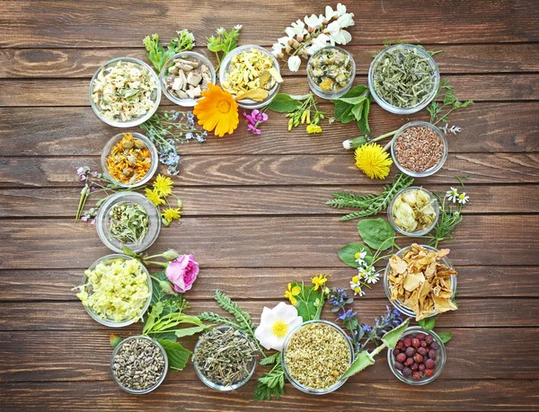 Herb selection and fresh flowers in bowls