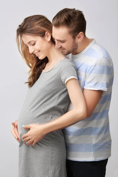 Happy family expecting baby