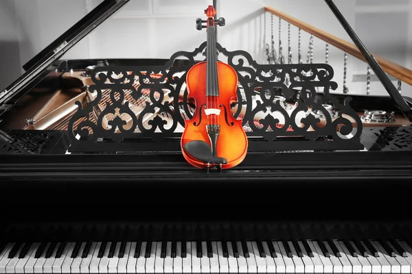 Piano with violin, close up