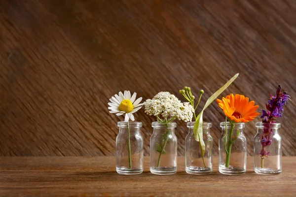 Healing flowers in glass bottles