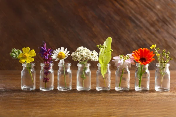 Healing flowers in small glass bottles