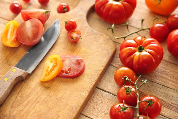Tomatoes on wooden cutting board