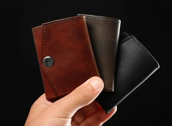 Man holding wallets