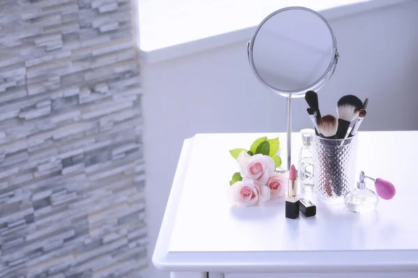 Cosmetic set on dressing table