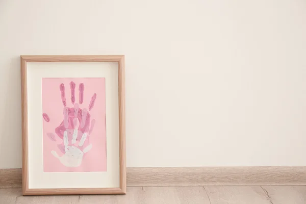 Family hand prints in frame