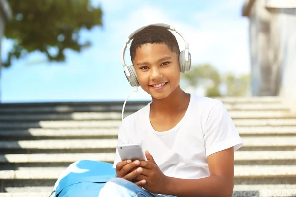 African American boy listening music