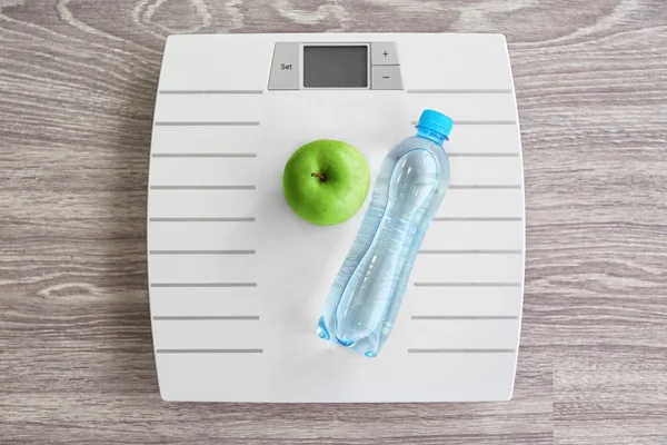 White floor scales and apple