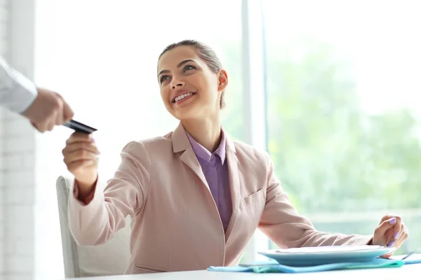 Businesswoman paying restaurant bill