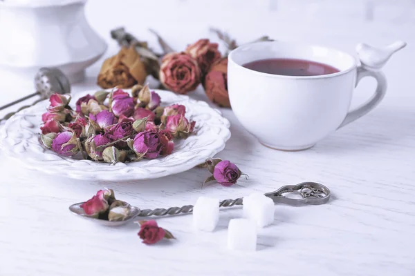 Tea and tea rose flowers