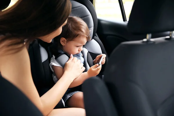 Mother and child in car