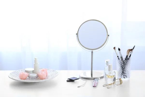 Cosmetic set on light dressing table