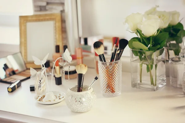 Cosmetic brushes with jewelry holder