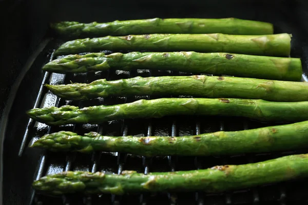 Asparagus on frying pan