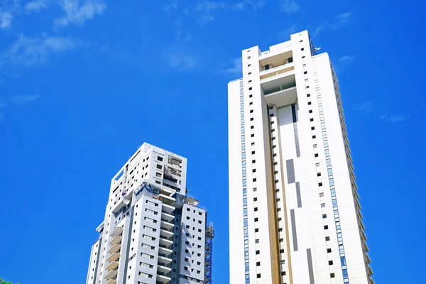 Tall house on blue sky