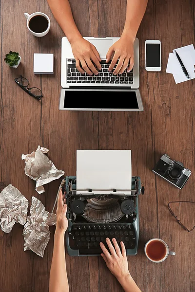 Old typewriter and laptop