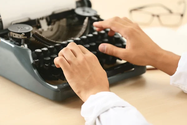 Man working on retro typewriter