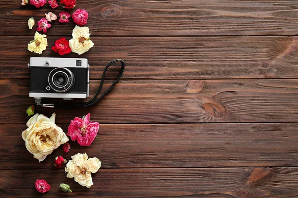 Vintage camera and colourful flowers