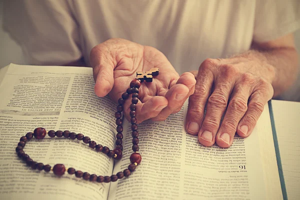 Old man reading the Bible