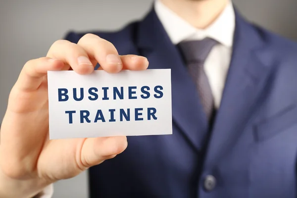 Business trainer with business card