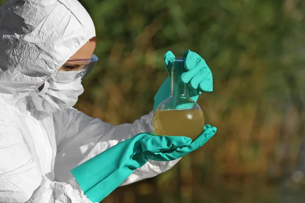 Woman with flask for expertise