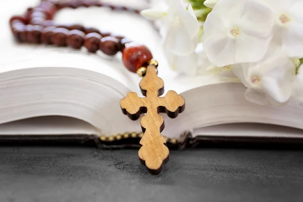 Wooden cross with flowers