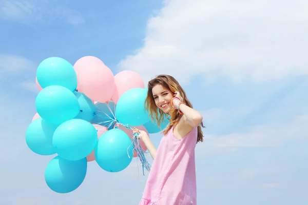 Woman with colorful balloons