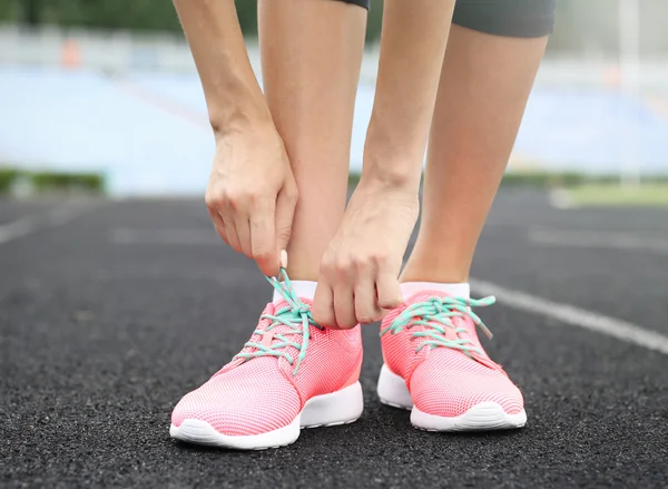 Woman tying laces