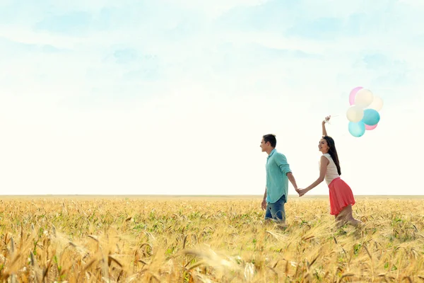 Couple with toy air balloons