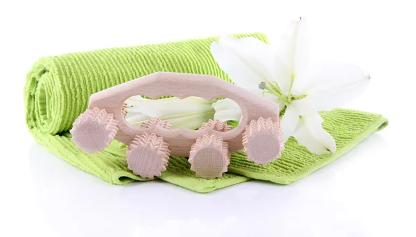 Wooden roller brush, towels and lily on white background isolated