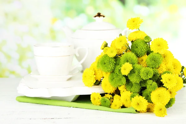 Flowers, teapot and cup