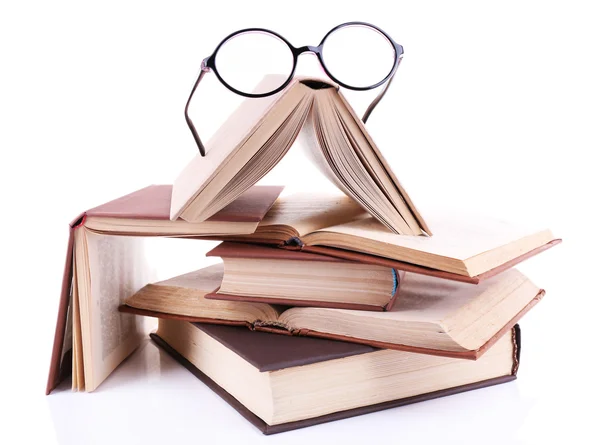 Books in a mess and glasses