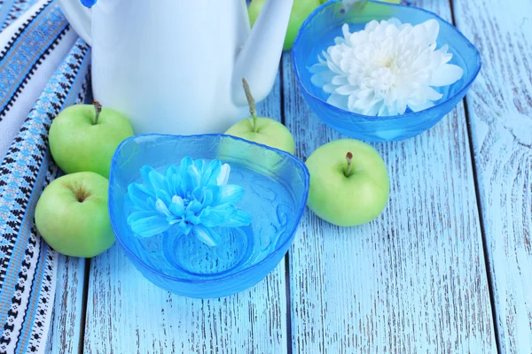 White and blue chrysanthemum and apples