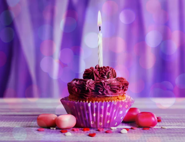 Tasty cupcake with  candle