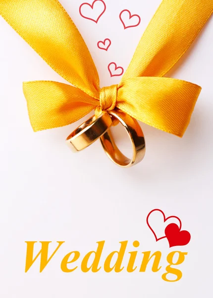 Wedding rings tied with ribbon