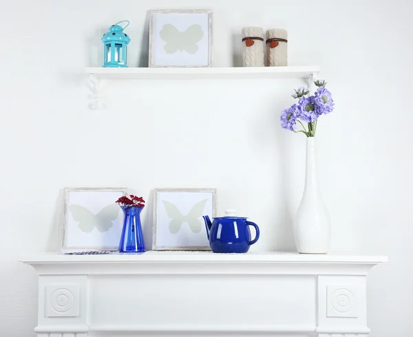 Different objects on white shelf