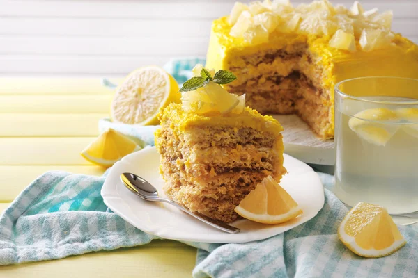 Tasty lemon dessert on wooden table