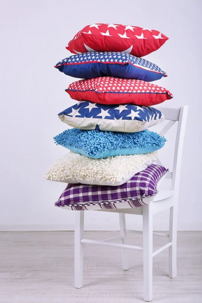 Bright pillows on chair