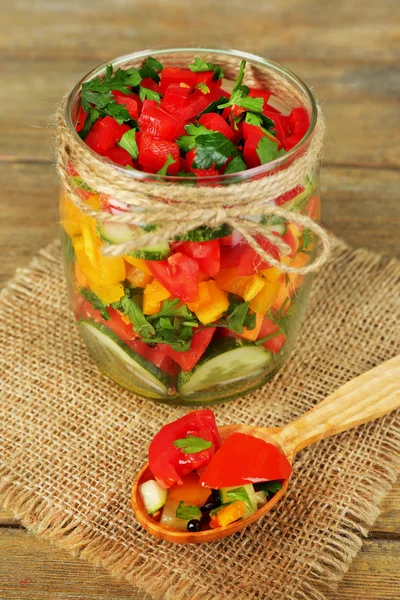 Vegetable salad in glass jar