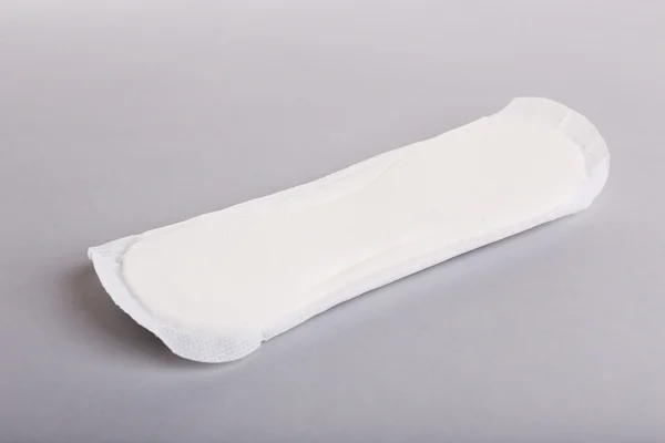 Sanitary pad on light background