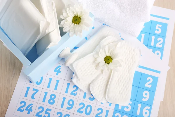 Sanitary pads and white flowers