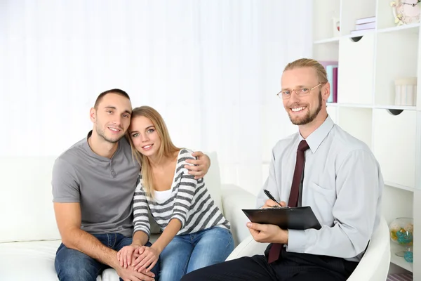 Young happy couple after therapy session with family psychologist