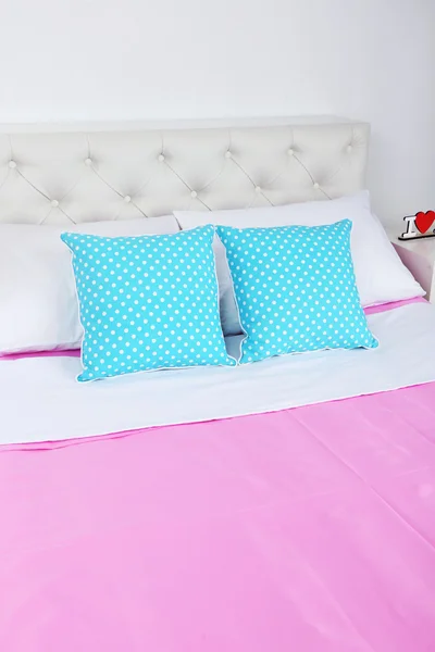 Bed in pink linen