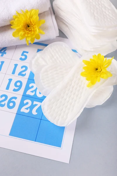 Sanitary pads and yellow flowers