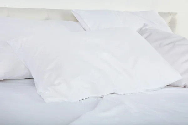 White pillows on bed