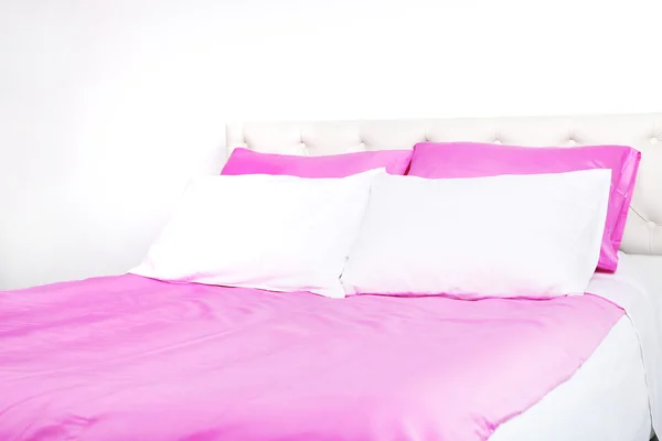 Bed in pink bed linen