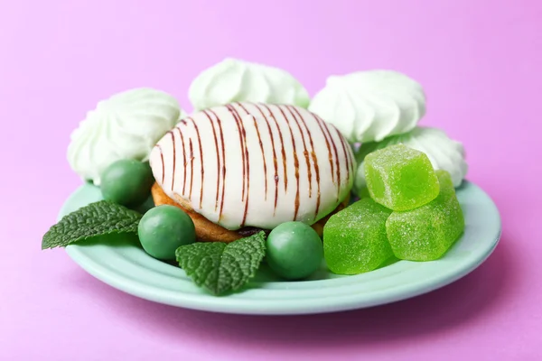 Mint color meringues, mint candies and cake