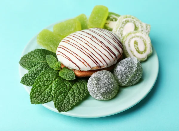 Mint color meringues, mint candies and cake